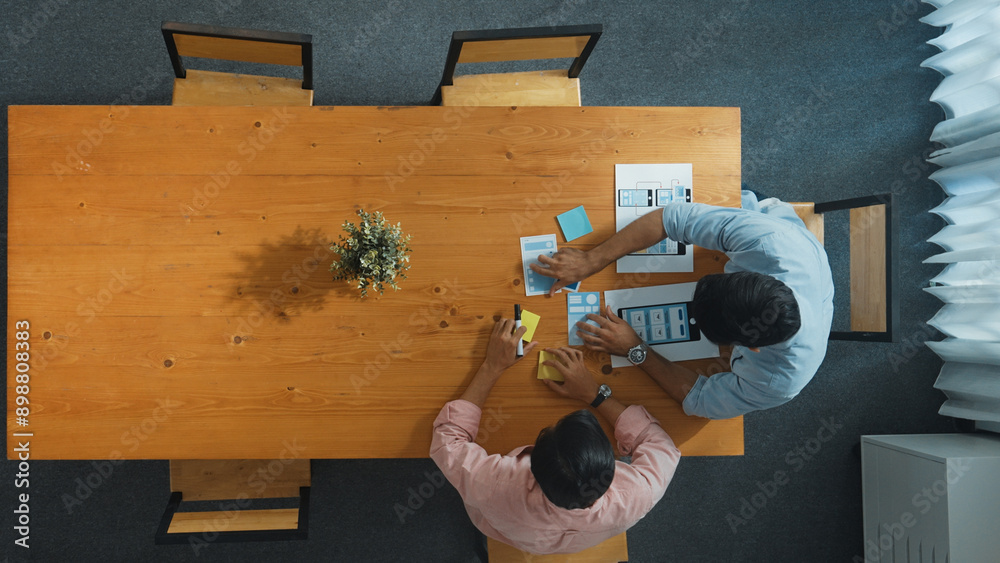 Poster top down view of business man prepare financial document for meeting while walking at table with col