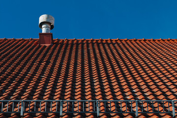 sloping roof with red tiles 