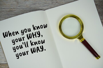 When you know your why, you'll know your way text message written on note page with magnifying...