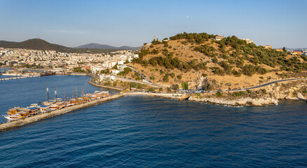 Fototapeta premium Kusadasi, Aydin, Turkey. Kusadasi is a touristic beach resort town on Turkey. Aerial view of Kusadasi.