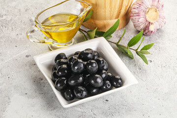 Black olives with oil and branch