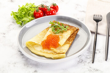 Russian pancake with red caviar
