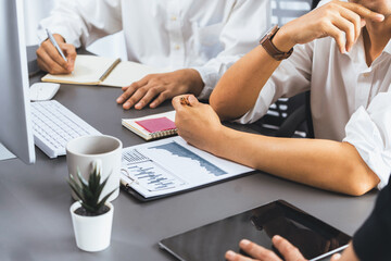 Data analysts team of office worker collaborate on business intelligence BI dashboard to analyze financial, trend, and marketing data. BI software utilization drive business success. Prudent