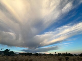 clouds over desert field