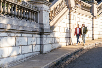 Two marriedngay men walking on the street. Copy space