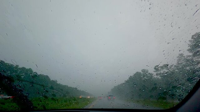 Driving through severe thunderstorms on the highway. 4k stock video b roll