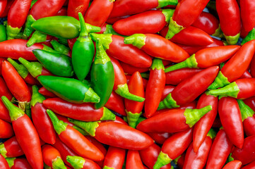 Set of small defocused red chillies, useful for picture background.