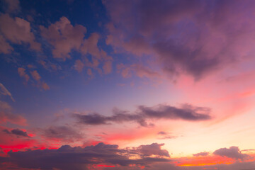 Fototapeta premium Beautiful Vivid sky painted by the sun leaving bright golden shades.Dense clouds in twilight sky in winter evening.Image of cloud sky on evening time.Evening Vivid sky with clouds