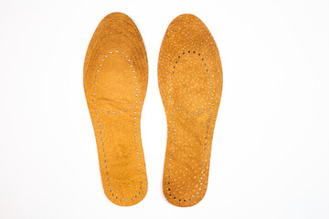 Leather orthopedic shoe insoles. Manufacturing of comfortable insoles for shoes, boots