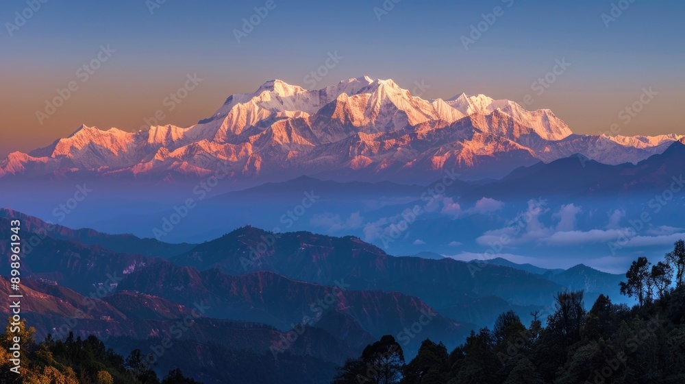 Poster panoramic view of a mountain range at sunset with vibrant colors and misty atmosphere