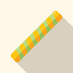 Green and orange striped wafer roll with filling lying on white background