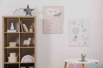 Child's room interior with modern furniture and beautiful pictures on wall