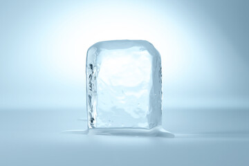 Cube of clear ice on light blue background