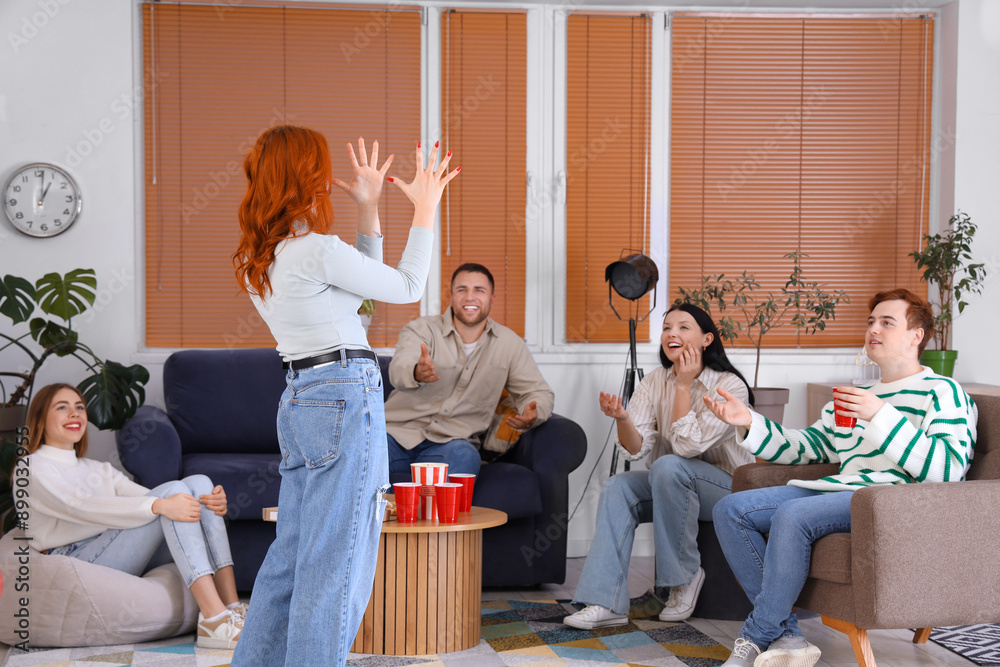 Canvas Prints Group of young friends playing game at home