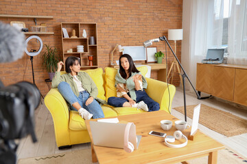 Young women recording podcast at home