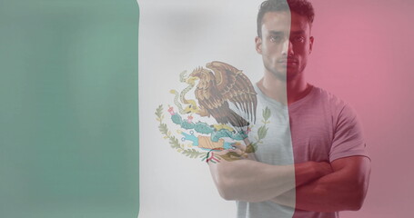 Image of flag of mexico over biracial strong man
