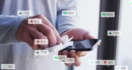 Cleaning smartphone screen, social media notifications image over hands