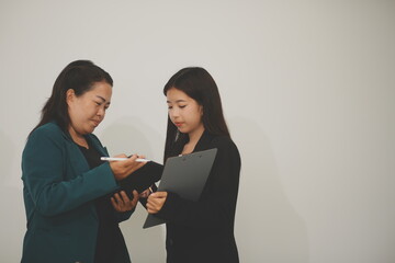 Pretty Asian female lawyer working and hammer, laptop, justice advice and legal concept. In office