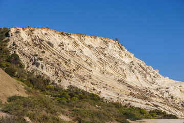 View of coastline at nature reserve of Torre Salsa with beautiful white cliffs Dama Bianca Torre Salsa on a sunny day, Sicily, Italy