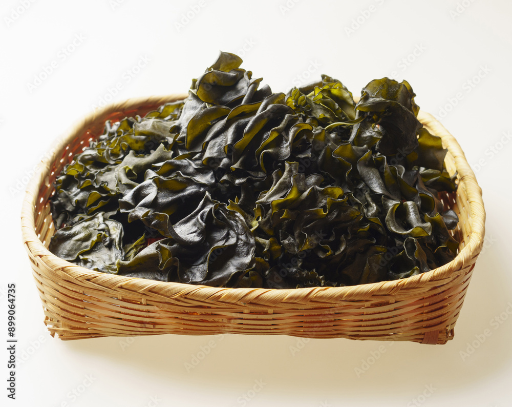 Canvas Prints Close-up of stacked dried raw brown seaweed with leaves and ears on bamboo basket, South Korea
