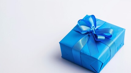 Obraz premium Beautifully Wrapped Blue Gift Box with Decorative Ribbon Bow