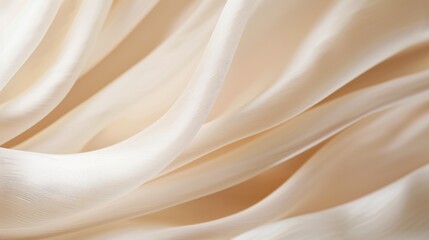 Obraz premium Close-up of a single strand of silk, illuminated by soft light, emphasizing its delicate structure and smooth, lustrous surface