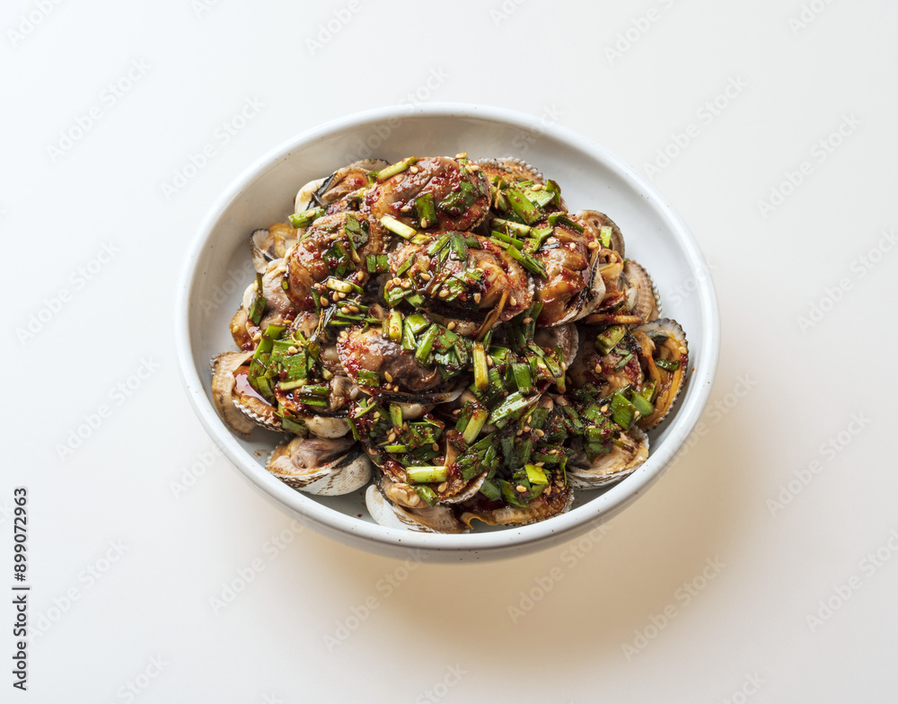 Poster Close-up of seasoned cockles with seasonings on white dish, South Korea
