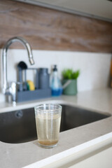 dirty glass of water at kitchen 