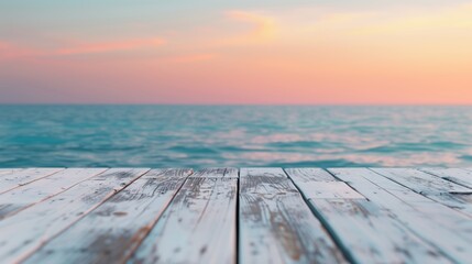 The warm glow of the sunset illuminates a wooden table by the water. Great for creating a peaceful atmosphere in your projects.