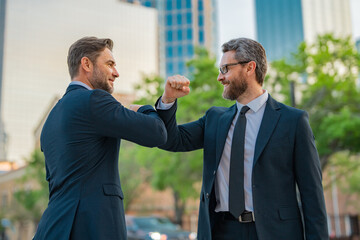 Business man shaking hands. Two businessmen handshake outdoor. Handshake business people. Business...