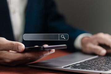 SEO search engine optimization concept. Businessman working with search bar on virtual screen. Marketing ranking traffic website, internet technology for business company.
