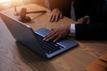 Judge gavel with Justice lawyers having team meeting at law firm background. Concepts of Law and Legal services.