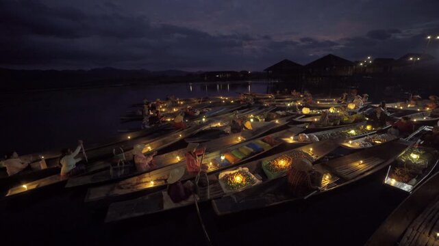 Damnoen Saduak Floating Market or Amphawa. Local people sell fruits, traditional food on boats in canal, Ratchaburi District, Thailand. Famous Asian tourist attraction destination. Festival in Asia.
