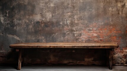 Vintage weathered wooden table placed against a dark concrete block wall, creating a contrast of textures and colors.