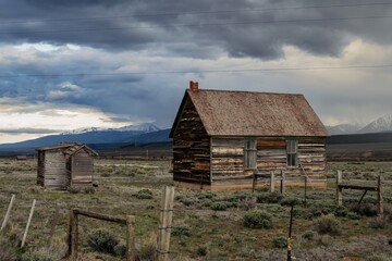 Abandoned historic log farm cottage in remote countryside. Leadville, Colorado, United States of America.