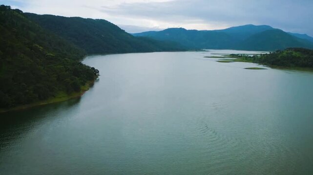 Aerial drone View of Mountain & Lake Drone footage, of river and beautiful natural green forests on a sunny summer day in, Umiam Lake, Meghalaya