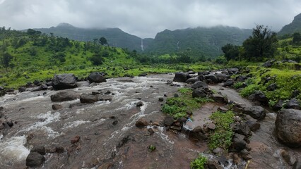 Scenic view of a stream winding through the Sahyadri hills.