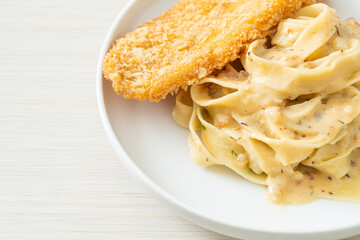 fettuccine pasta white cream sauce with fried fish