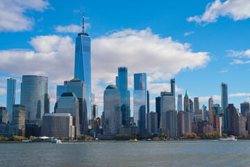 The city skyline of New York City in USA, United States. Blue sky day with iconic buildings. New York City NYC Manhattan Downtown Skyline, viewed from Jersey City, USA.