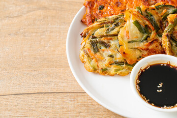 Pajeon or Korean pancake and Korean Kimchi pancake or Kimchijeon on white background