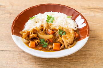 Japanese curry rice with sliced pork, carrot and onions