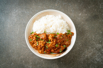 chicken tikka masala with rice on plate