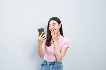 Model asian woman emotion happy and excited to win prizes with online lottery tickets on their mobile phones.