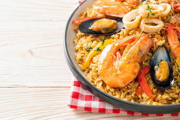 Seafood Paella with prawns, clams, mussels on saffron rice