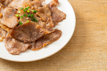 grilled pork neck sliced on plate