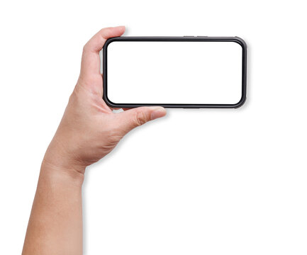 A hand holding a mockup smartphone with empty transparent screen in horizon landscape view. Background cutout.
