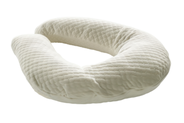 A Soft, White Pregnancy Pillow Shaped Like a C Rests on a White Background
