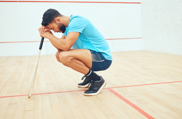 Stress, athlete and man in court, serious and sad for playing in sports, training and practice. Fitness, sportsman and disappointed for fail in tournament, squash player and routine for exercise