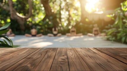 Obraz premium Wooden Tabletop with Blurred Background of Yoga Practice in a Tranquil Garden