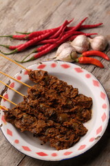 Clam Satay. Sate Kerang. Made from clams, chili, garlic, salt, spices. Blood clams are a type of clam commonly eaten by East and Southeast Asians. Tegillarca granosa. Indonesian food.